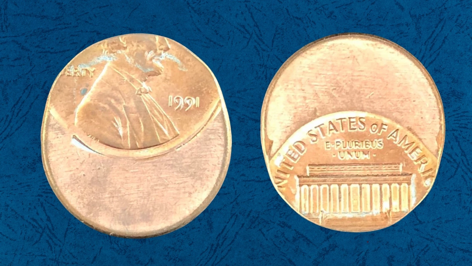 1991 Lincoln cent struck off-center approximately 30% with the date still visible and a large blank crescent area